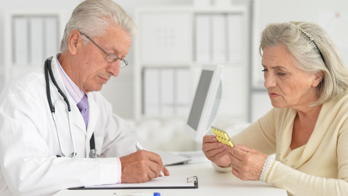 Cardiologist explaining tailored medication adjustments to a patient based on genetic insights