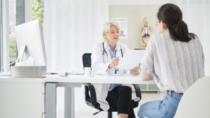 Healthcare professional explaining preventative medicine options to a client