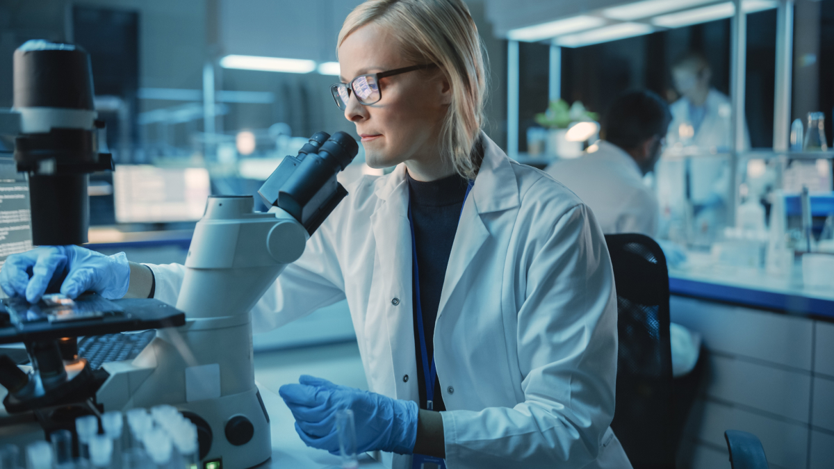 Laboratory researcher analyzing cell cultures for advanced regenerative medicine