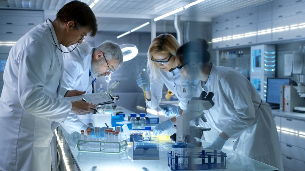 Medical researchers conducting advanced research using cutting-edge laboratory equipment in a Swiss hospital's biomedical research facility